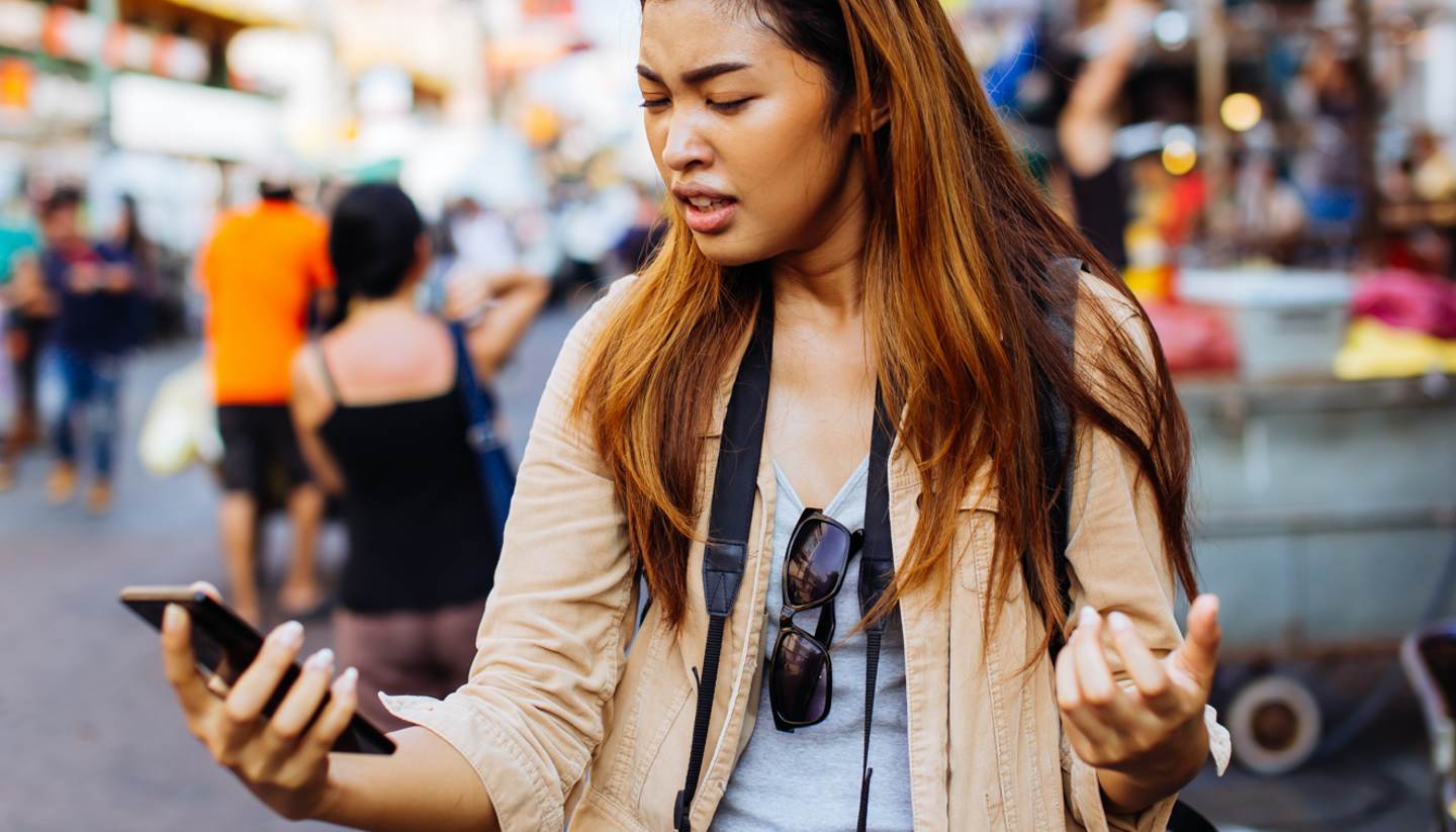 How to avoid expensive travel mistakes - An unhappy tourist